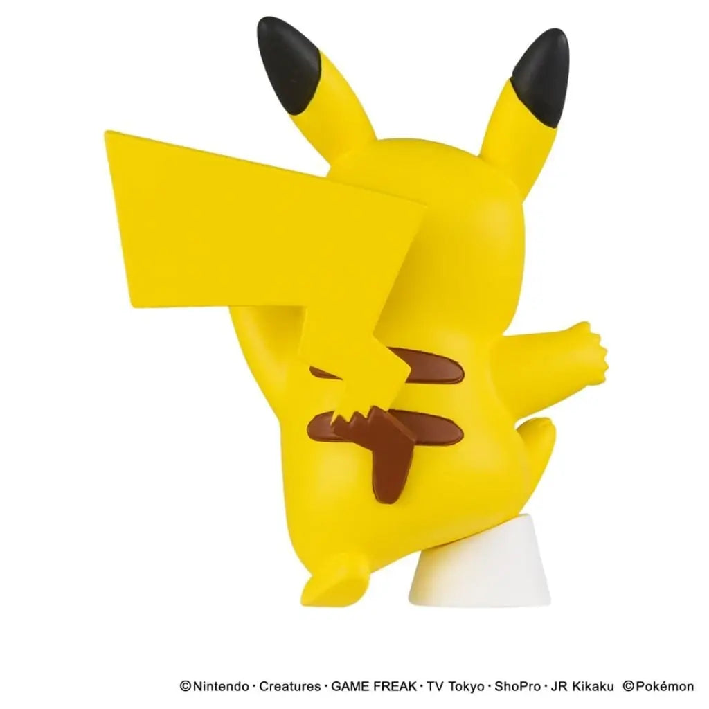 Rear view of a Pikachu figure with a lightning-shaped tail, outstretched arm and white support.