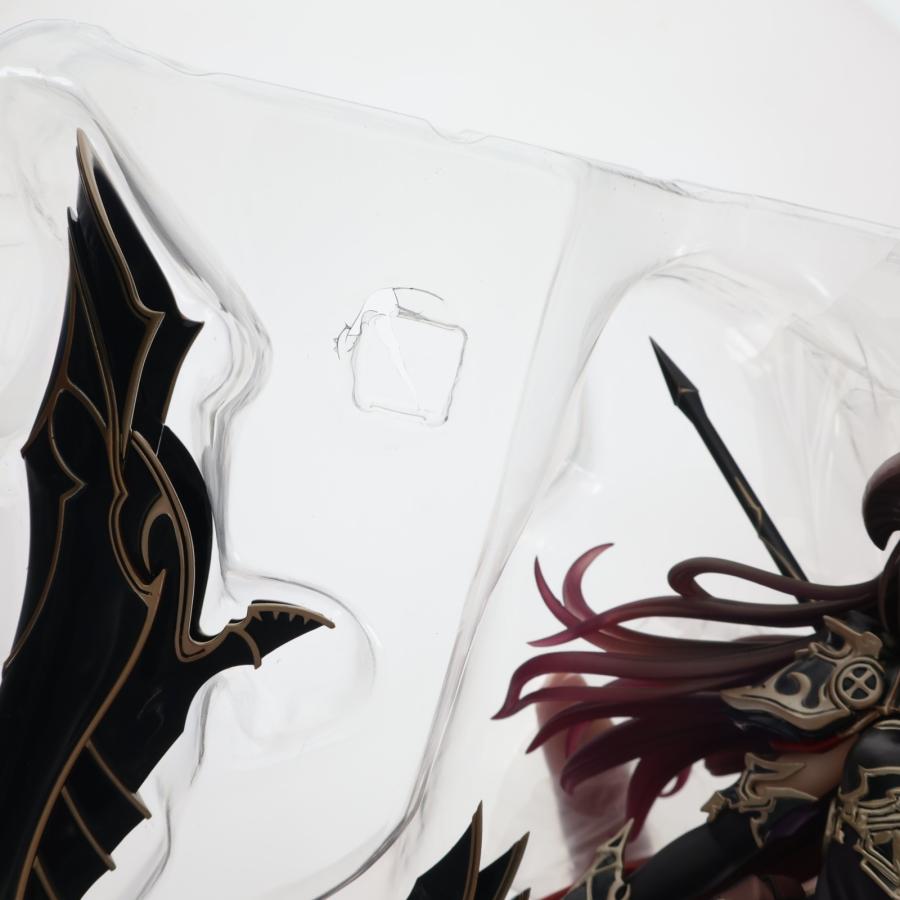 A figure is visible inside a clear plastic blister tray against a white background.