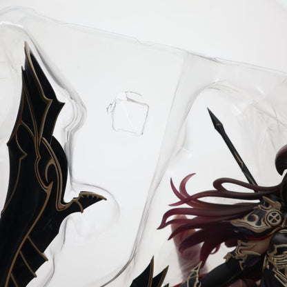A figure is visible inside a clear plastic blister tray against a white background.