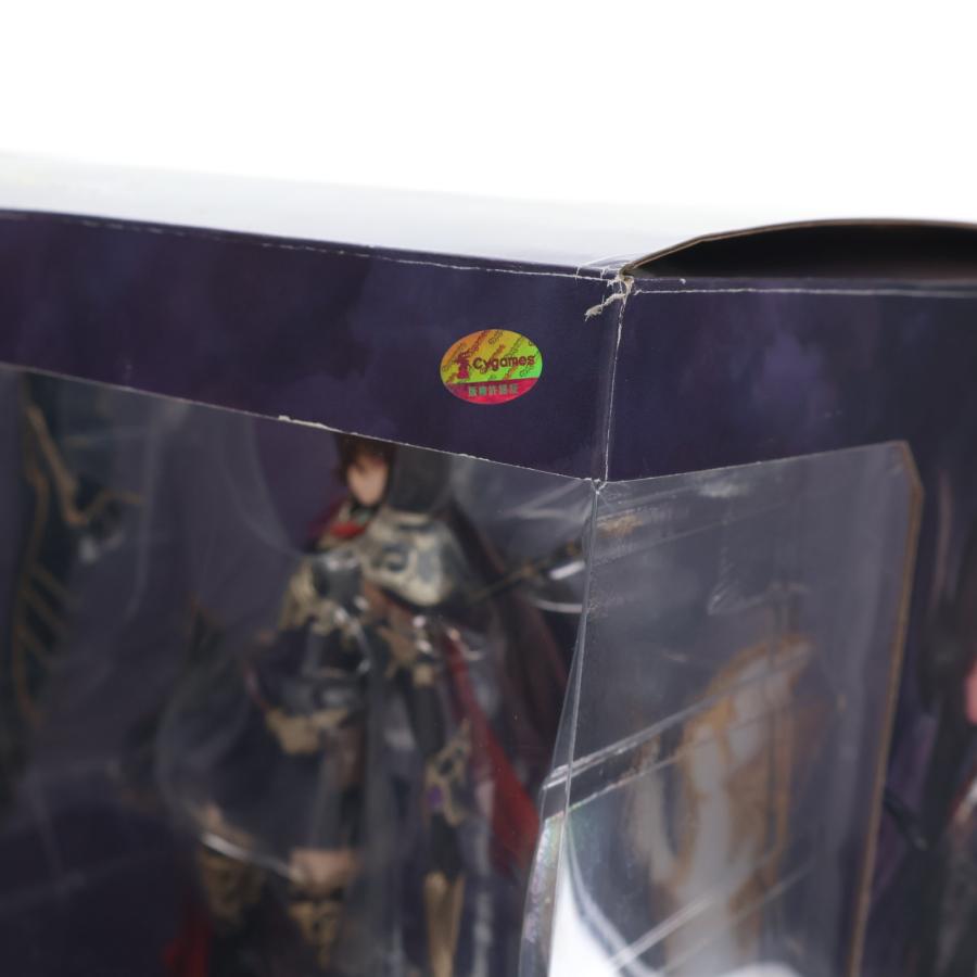 A boxed anime figure visible through a clear plastic window.