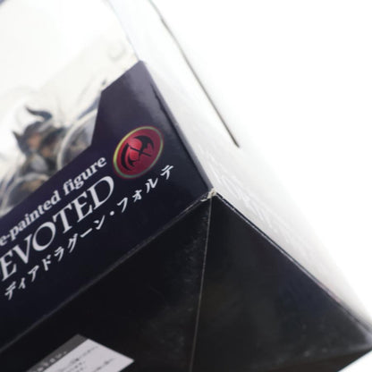 Close-up of a figure box corner with printed character art and text.