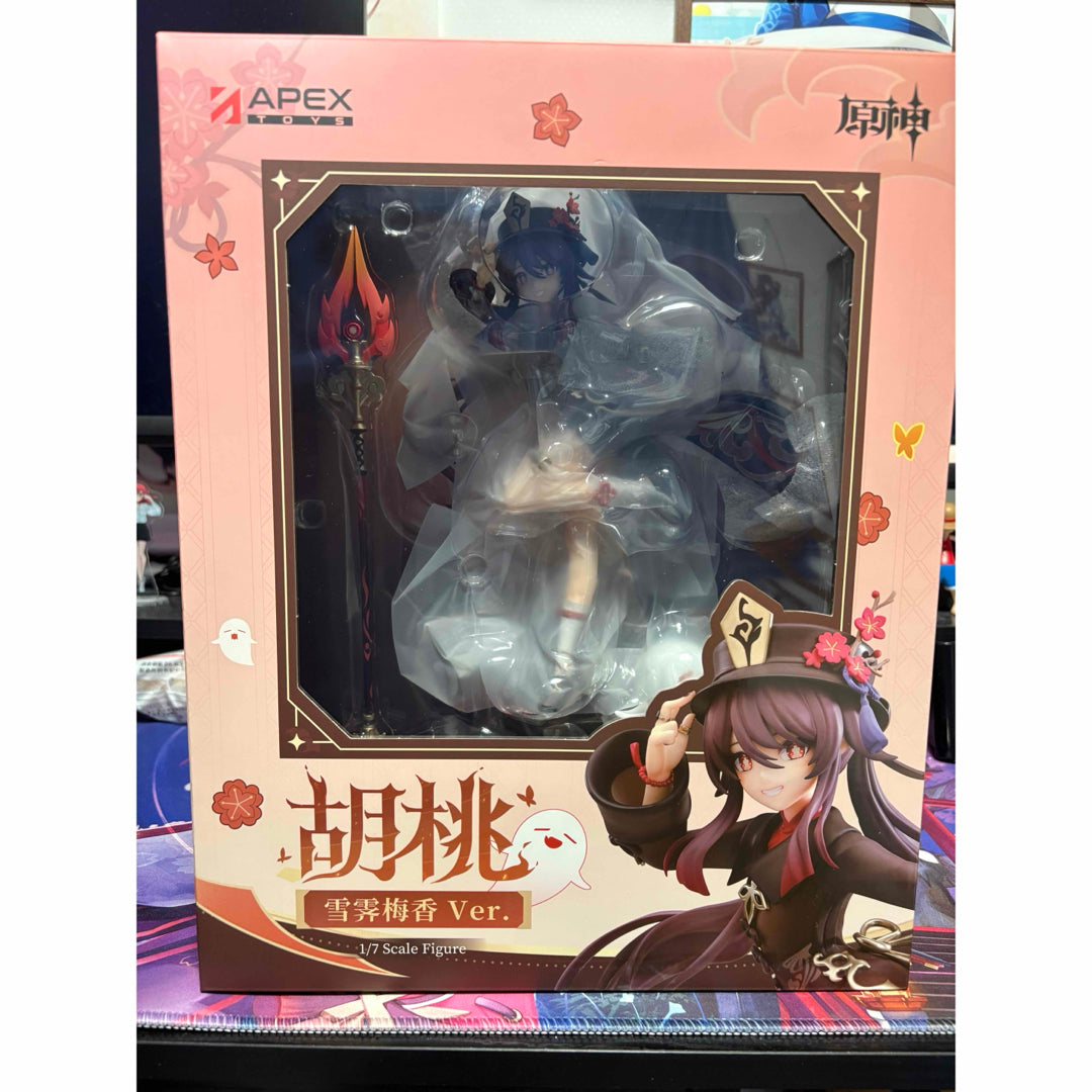 A boxed Hu Tao figure with a clear front window and printed character art.