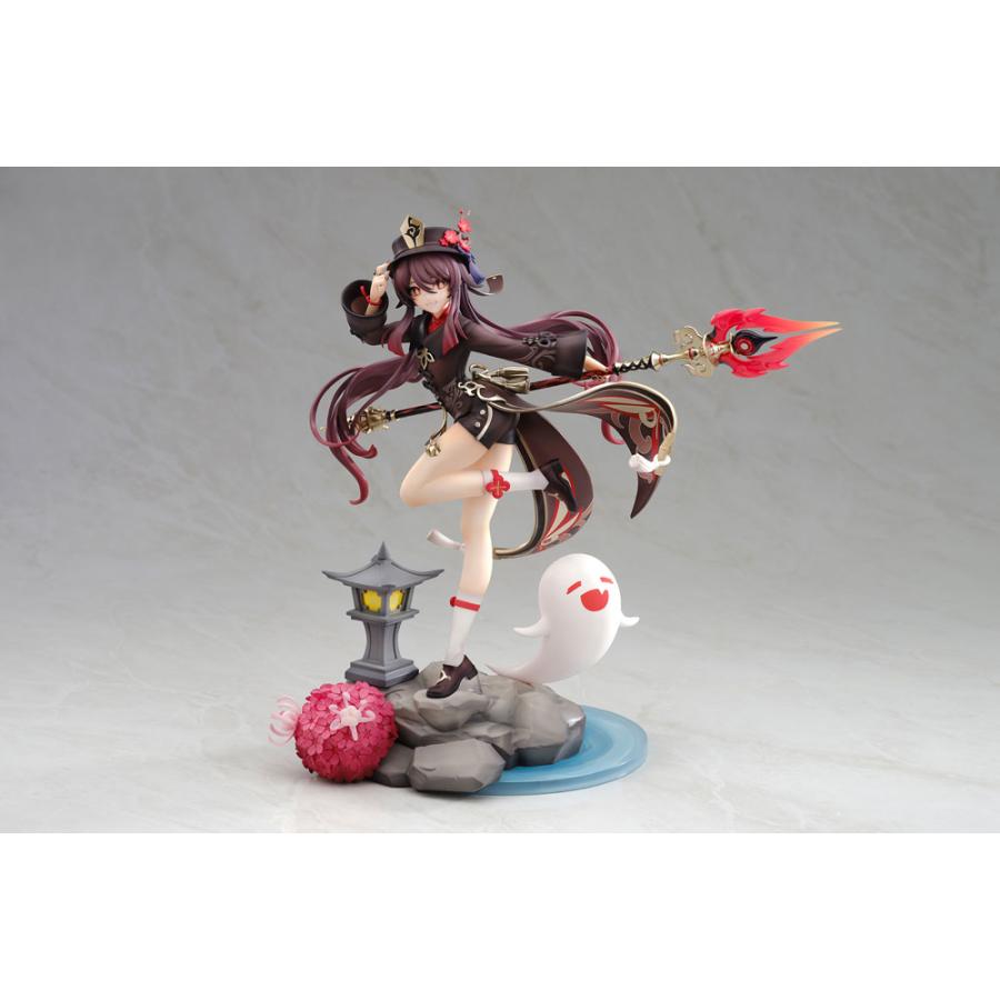 A Hu Tao anime figure posed with a spear, lantern, flower, and ghost on a display base.