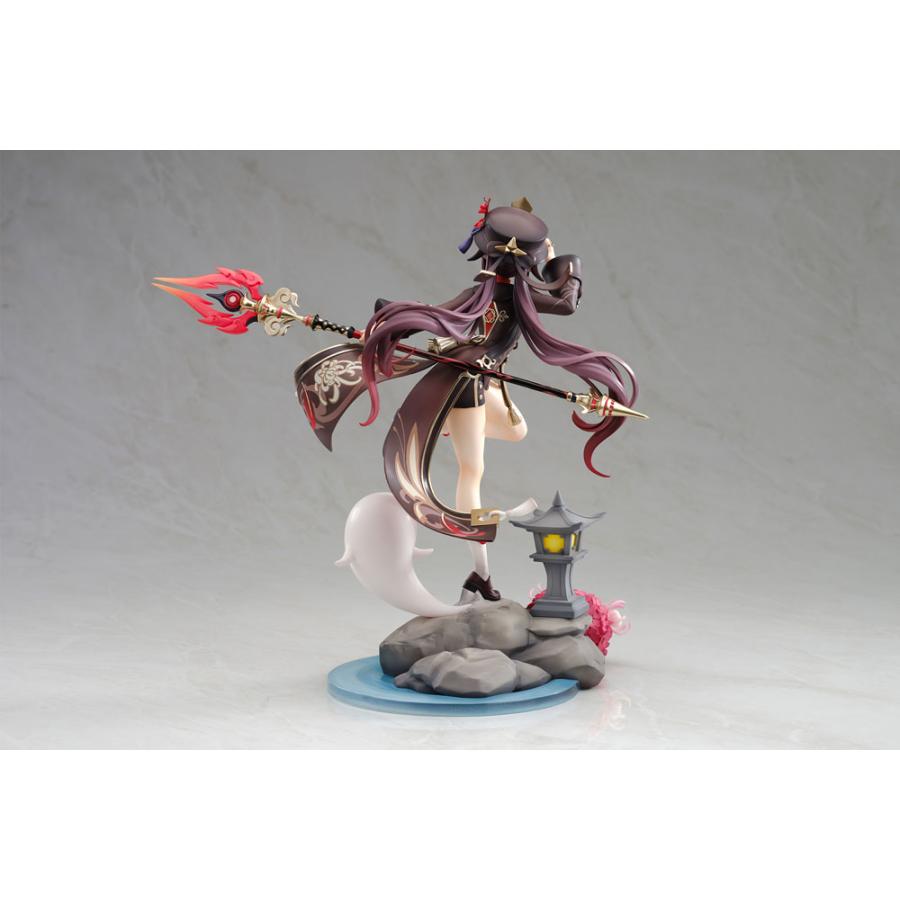 Hu Tao figure posed on a rocky base with a lantern and spear.